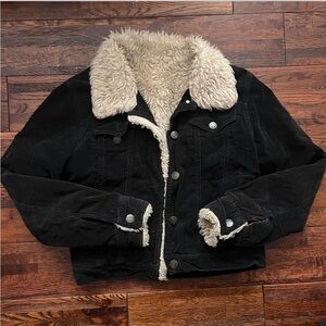 Black corduroy jacket with haul fur collar and sleeve accents